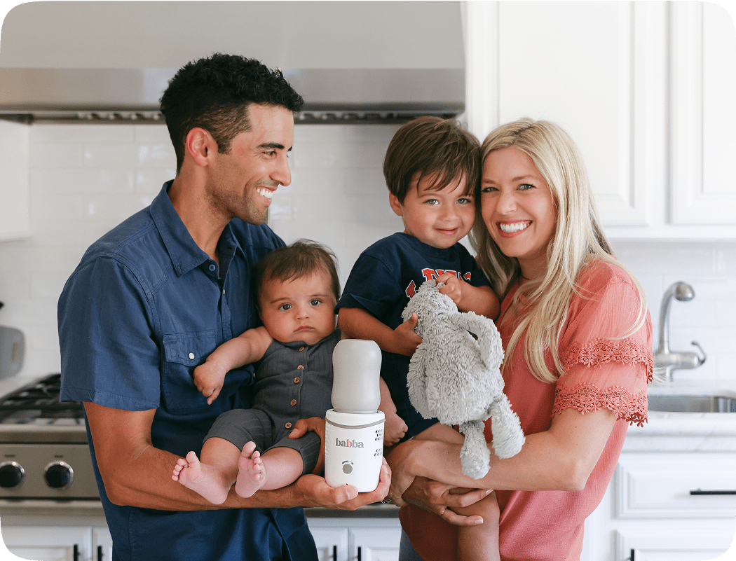 Smiling family holding the Babba portable baby bottle warmer, ideal for breastfeeding while traveling or on the go.