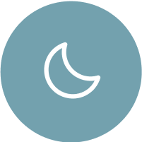 White crescent moon icon on a blue circular background, symbolizing night mode or sleep-friendly features.